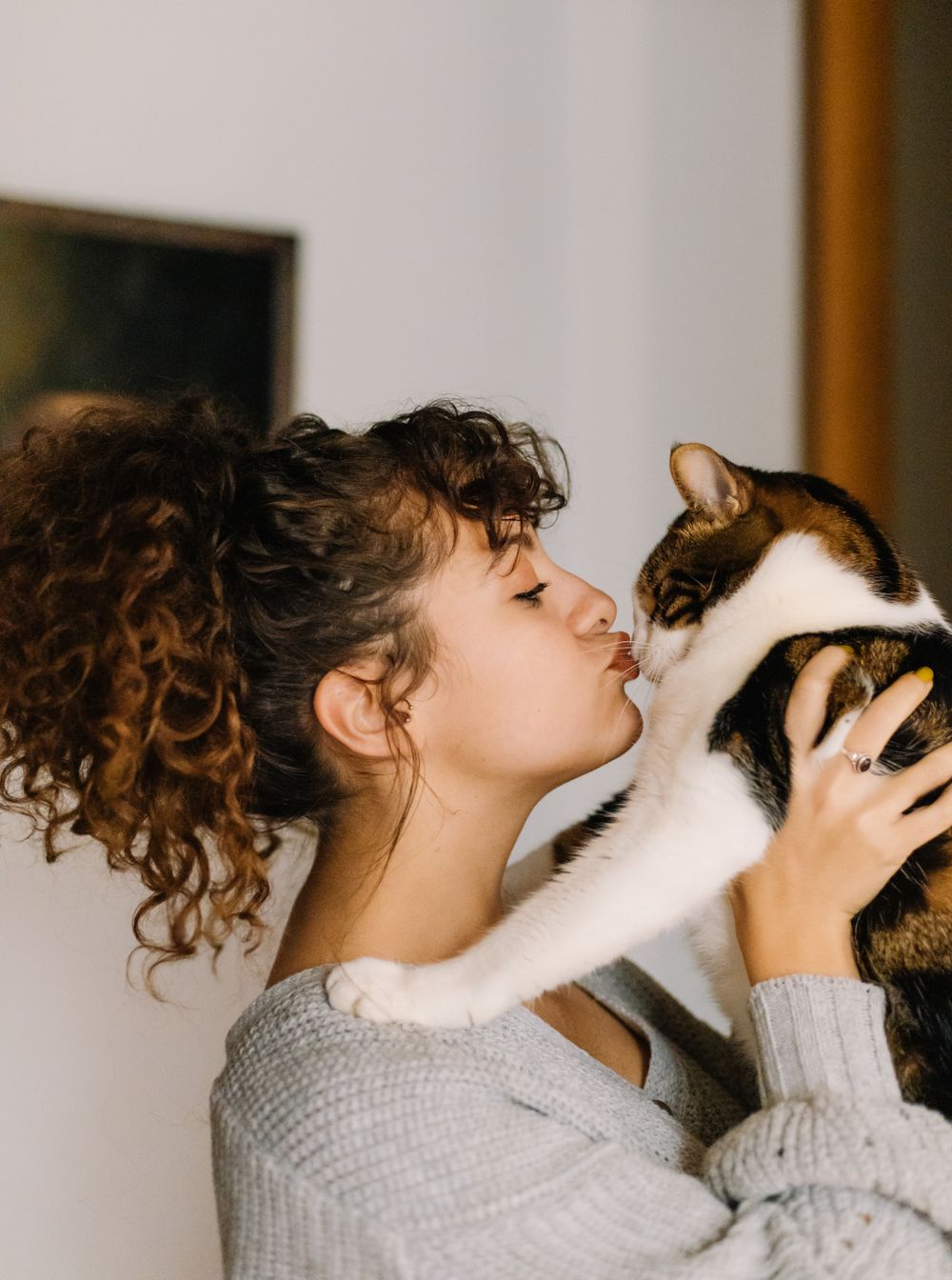 Owner nuzzling her cat